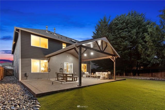 an aerial view of a house with a yard and garden