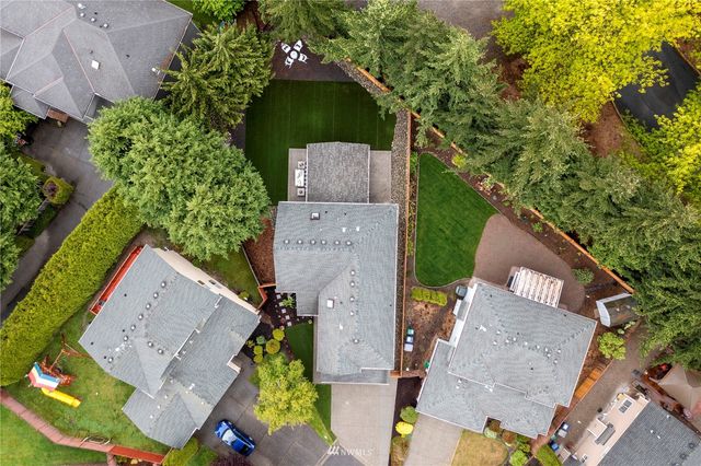 an aerial view of residential houses with city view