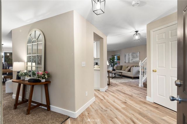 a living room with furniture and a table