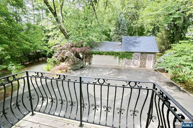 a balcony view with a garden