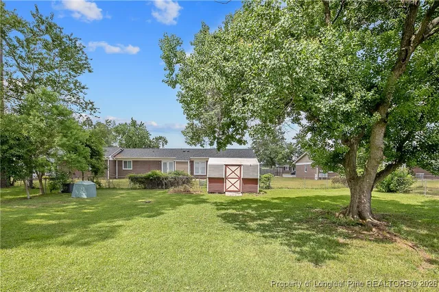 a view of a house with a big yard