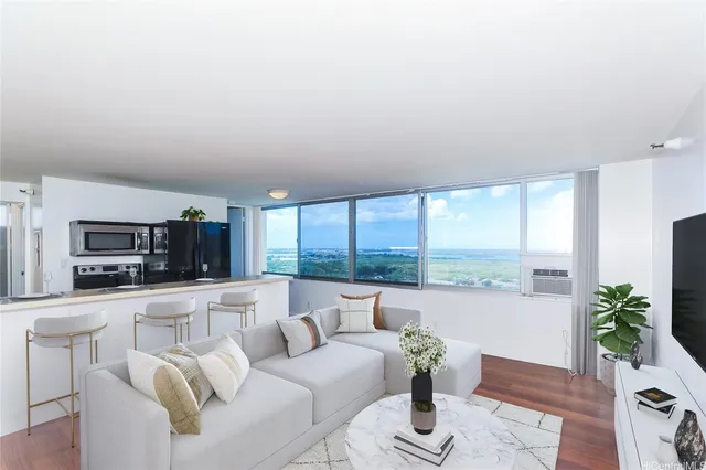 a living room with furniture and a large window