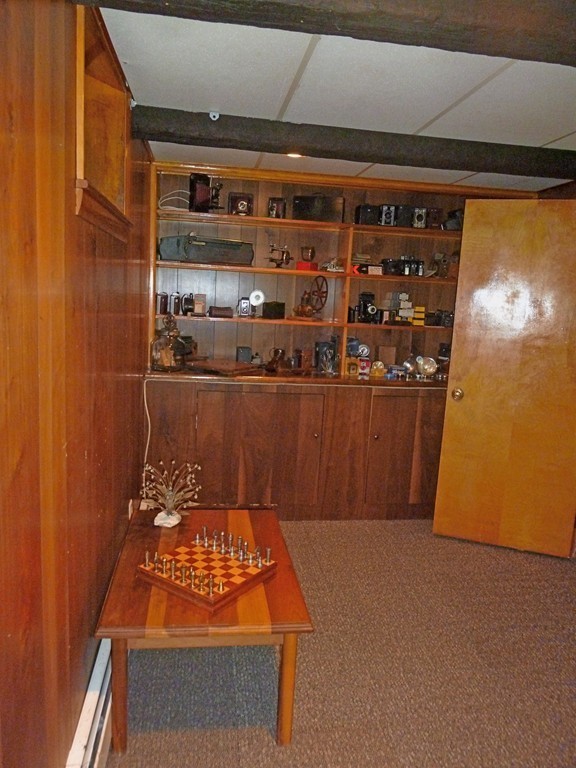 625 Westhampton Road Northampton, MA 01062 - Photo 20 of 30 a room with water heater and a wooden floor