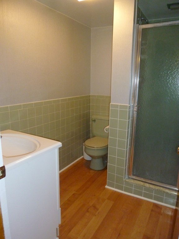 625 Westhampton Road Northampton, MA 01062 - Photo 21 of 30 a bathroom with a sink a toilet a mirror and shower