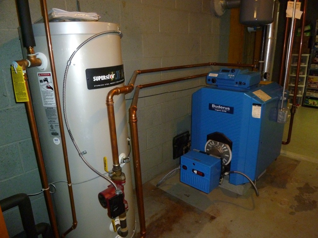 625 Westhampton Road Northampton, MA 01062 - Photo 26 of 30 a room with water heater and wooden closet
