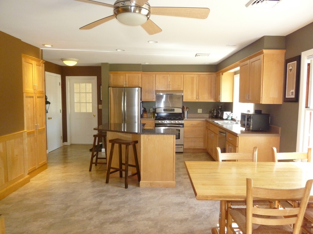 625 Westhampton Road Northampton, MA 01062 - Photo 3 of 30 a living room with stainless steel appliances kitchen island granite countertop furniture and a large window