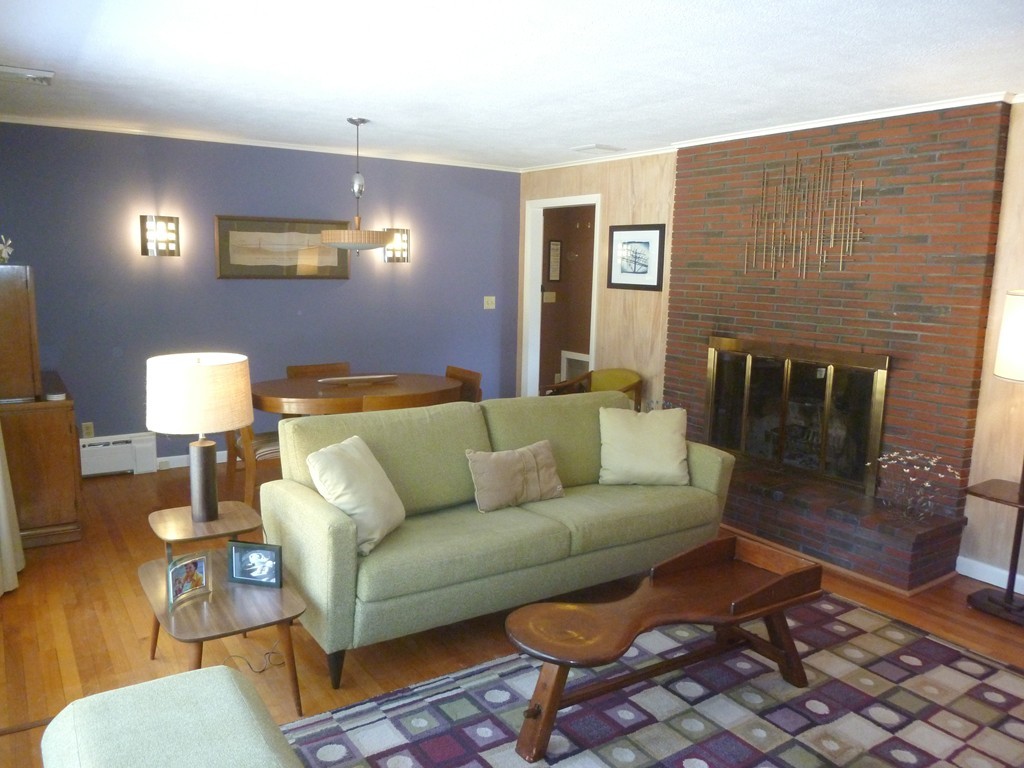 625 Westhampton Road Northampton, MA 01062 - Photo 7 of 30 a living room with furniture a lamp and a fireplace