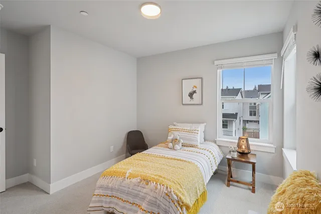 a bedroom with bed and a window