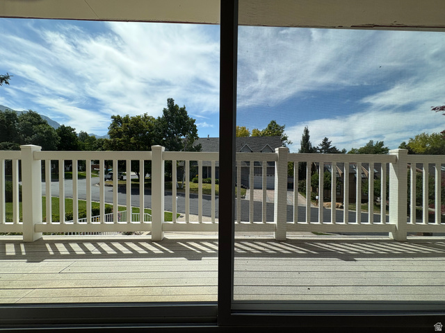 595 Meadowlark Road Orem, UT 84097 - Photo 14 of 87 Outdoor deck featuring composite decking, white railing, and sliding glass door access