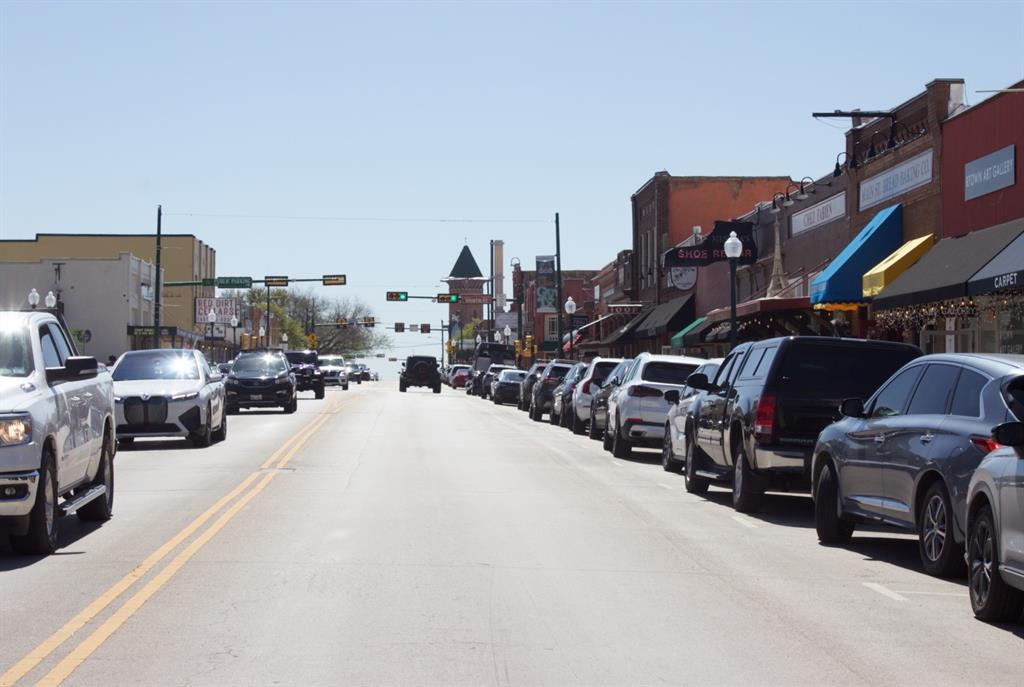 422 Smith Street Grapevine, TX 76051 - Photo 8 of 9 a view of cars parked in front of a house
