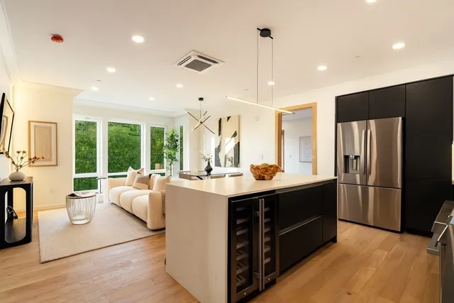 a kitchen with stainless steel appliances granite countertop a stove and a refrigerator