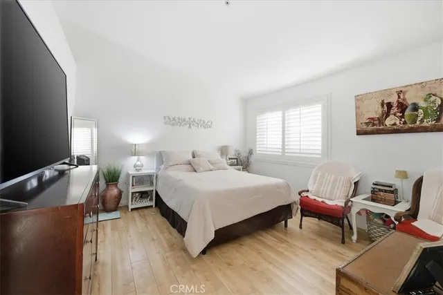 a bedroom with a bed and a chair