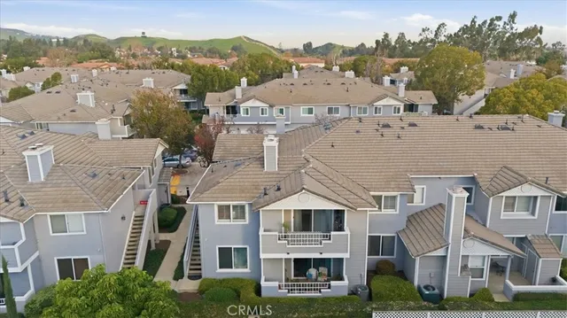 an aerial view of multiple houses with yard