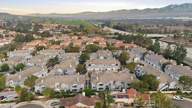 an aerial view of residential houses with outdoor space
