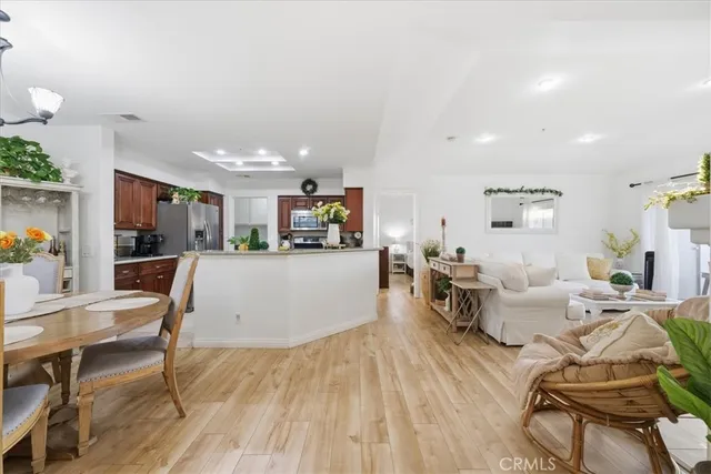 a living room with furniture and kitchen view