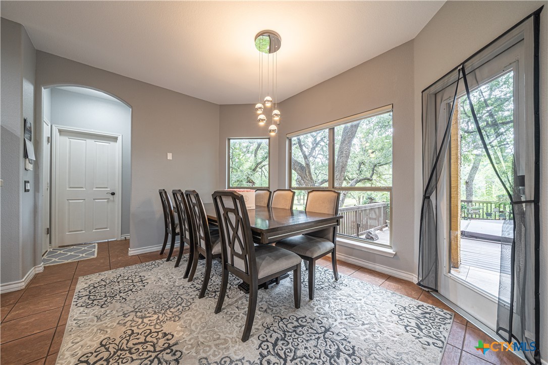 519 Long Meadow Spring Branch, TX 78070 - Photo 14 of 33 a view of a dining room with furniture window and wooden floor