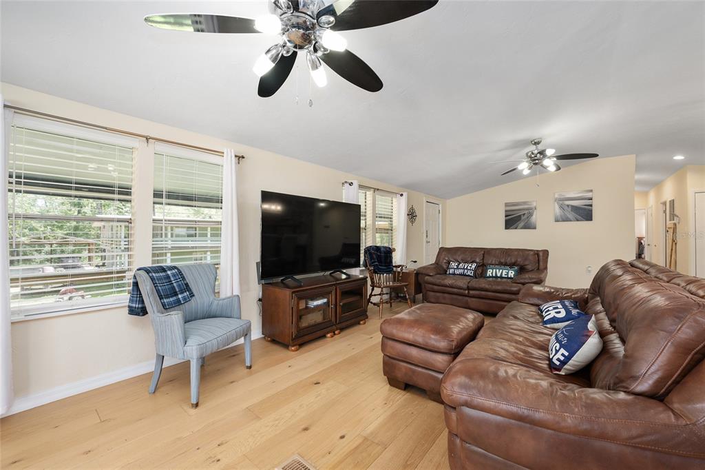 7870 Southwest 25th Place Bell, FL 32619 - Photo 68 of 99 a living room with furniture and a flat screen tv