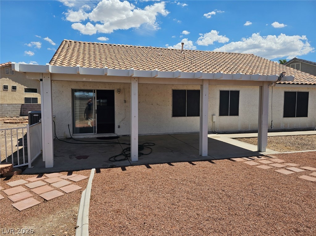 1418 Reebok Terrace Henderson, NV 89014 - Photo 27 of 38 A covered patio offers shade and outdoor living space in a low-maintenance backyard.