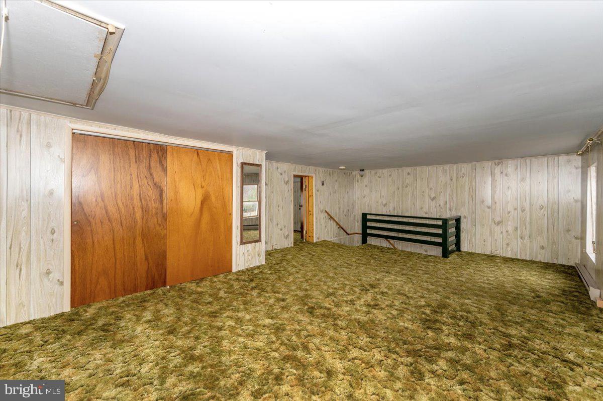 10622 National Pike Big Pool, MD 21711 - Photo 23 of 60 a view of a livingroom with an empty space and a hallway