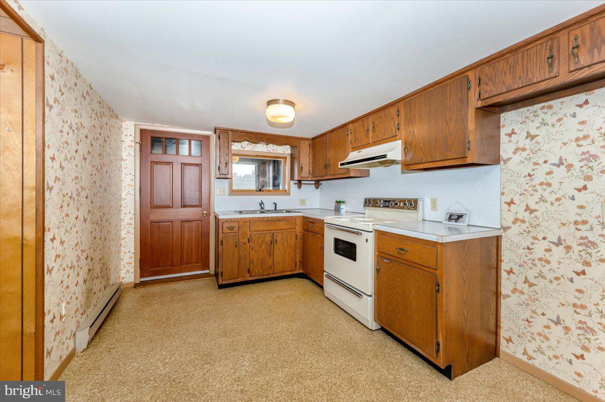 10622 National Pike Big Pool, MD 21711 - Photo 3 of 60 a view of utility room with washer and dryer
