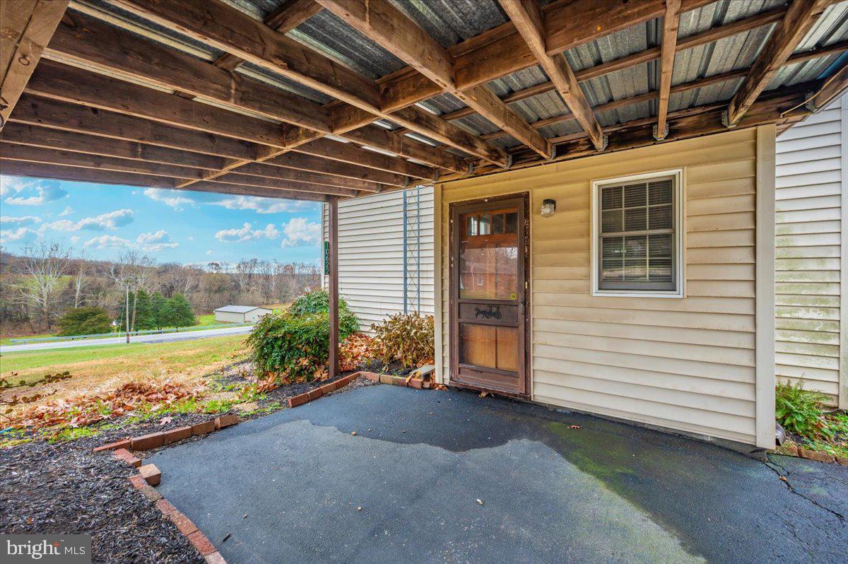 10622 National Pike Big Pool, MD 21711 - Photo 40 of 60 a view of a porch with garden