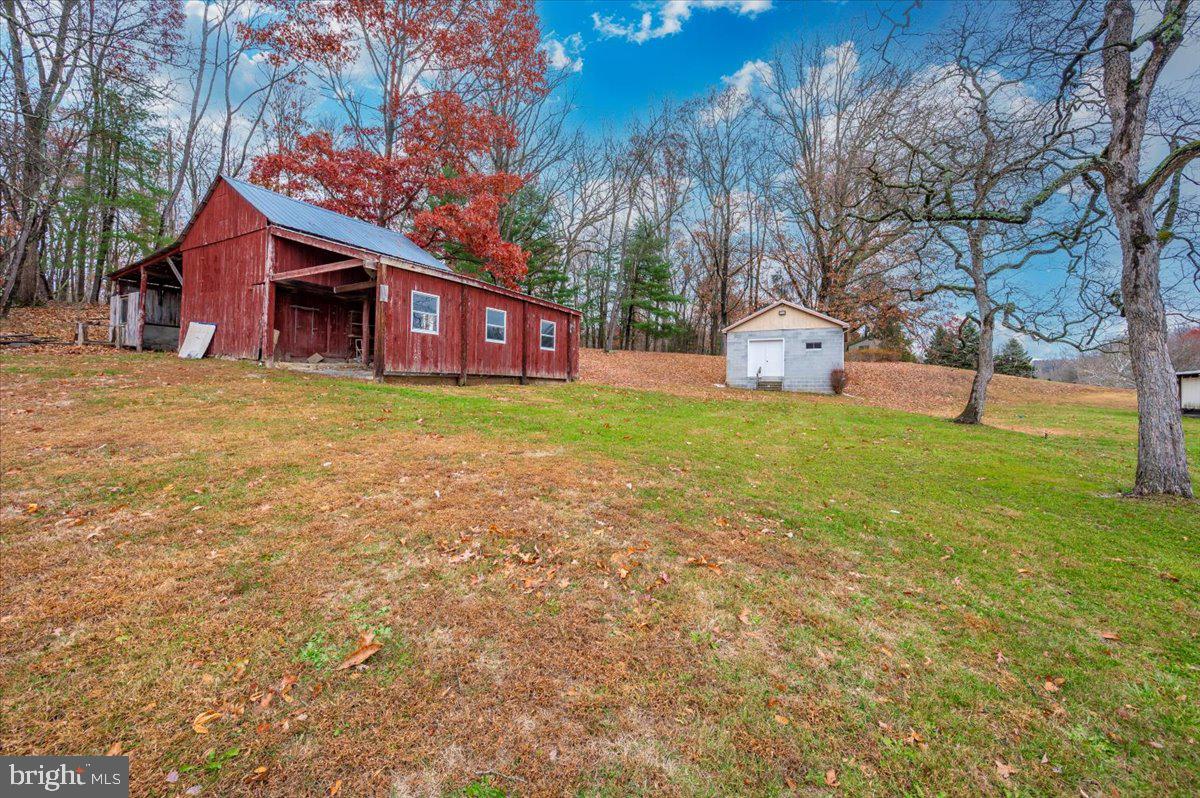 10622 National Pike Big Pool, MD 21711 - Photo 42 of 60 a small house in middle of the forest