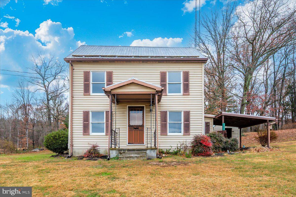 10622 National Pike Big Pool, MD 21711 - Photo 48 of 60 a front view of a house with a garden