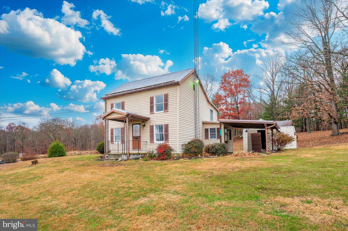 10622 National Pike Big Pool, MD 21711 - Photo 49 of 60 a front view of a house with garden