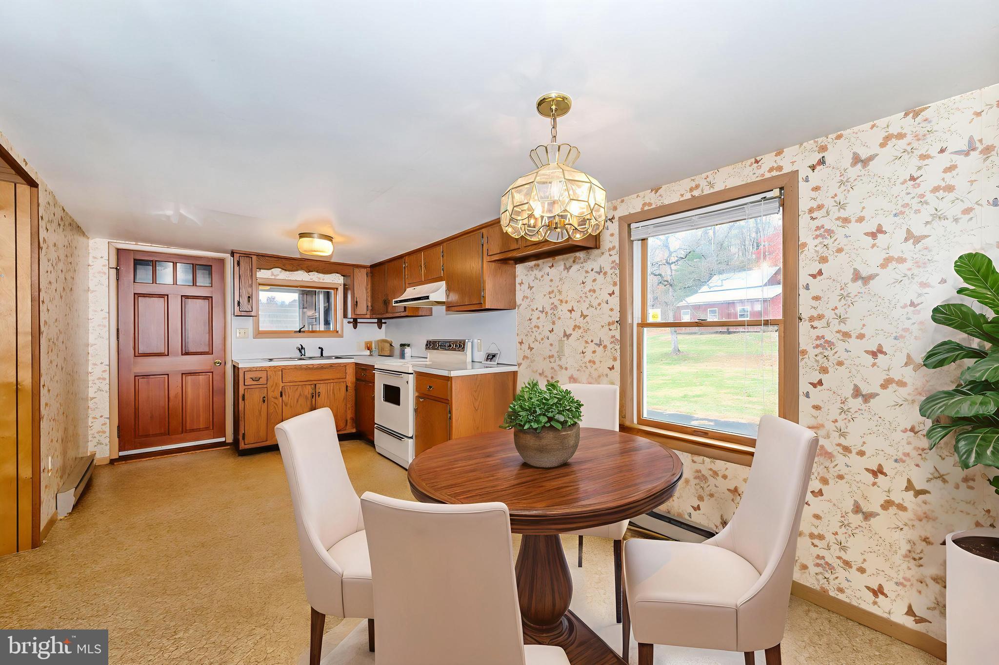 10622 National Pike Big Pool, MD 21711 - Photo 60 of 60 a view of a dining room with furniture and a chandelier