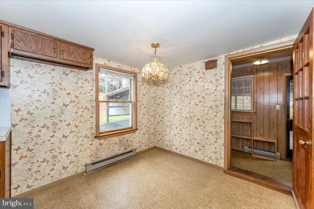 a kitchen with a stove and a refrigerator