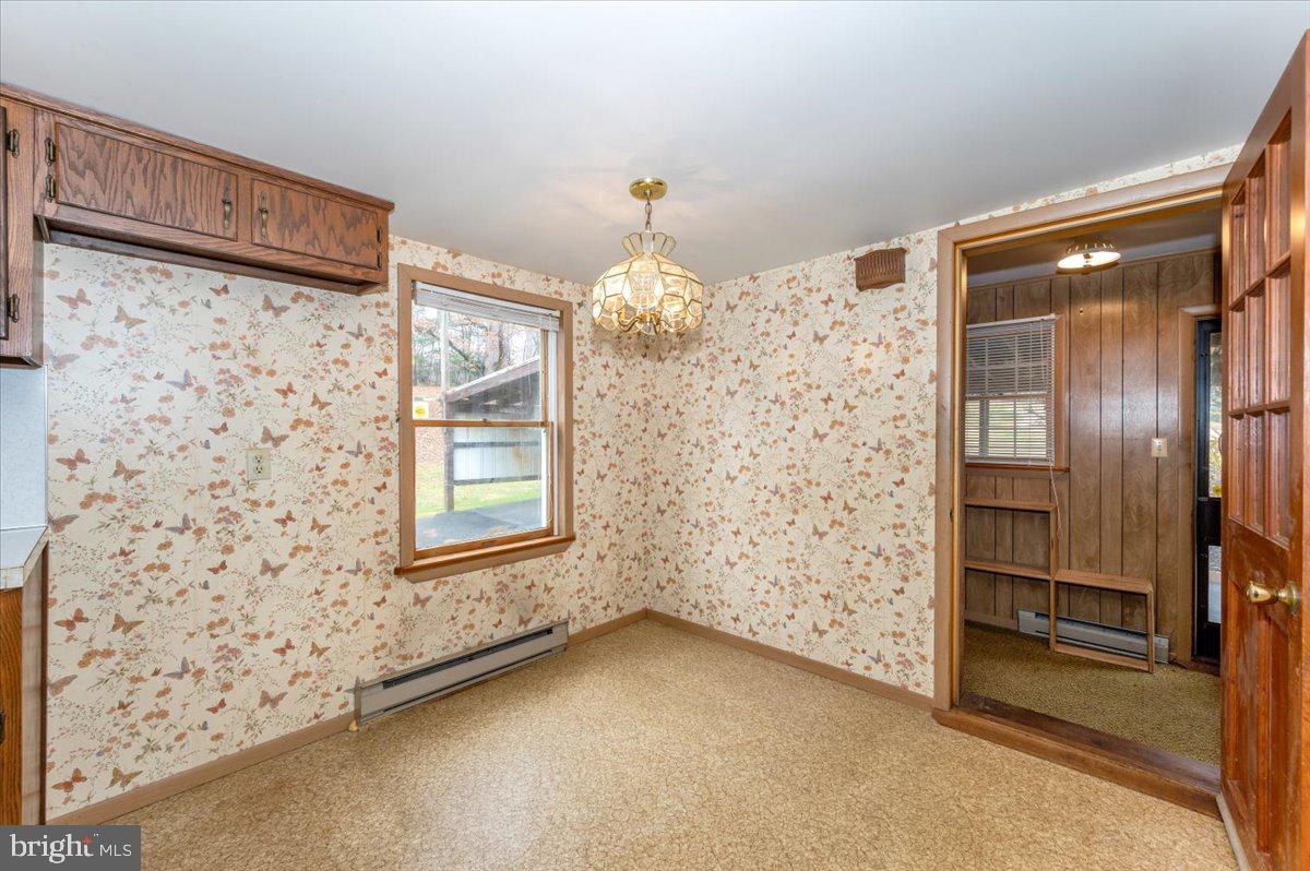 10622 National Pike Big Pool, MD 21711 - Photo 8 of 60 wooden floor in an empty room and a window