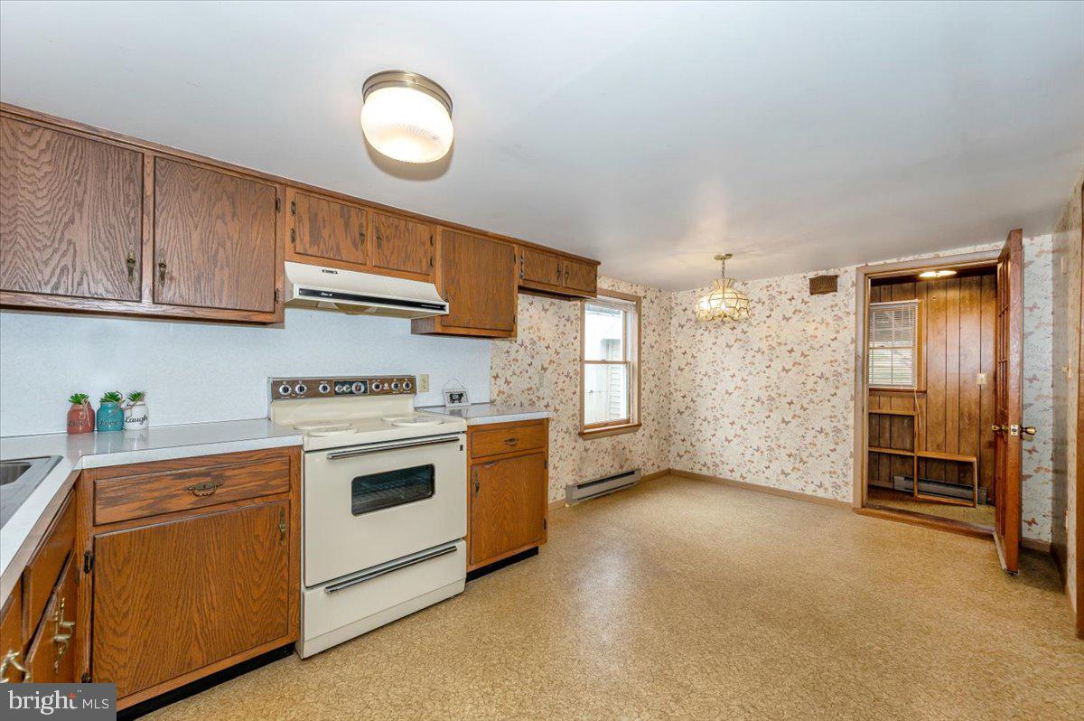 10622 National Pike Big Pool, MD 21711 - Photo 9 of 60 a kitchen with a stove and a refrigerator