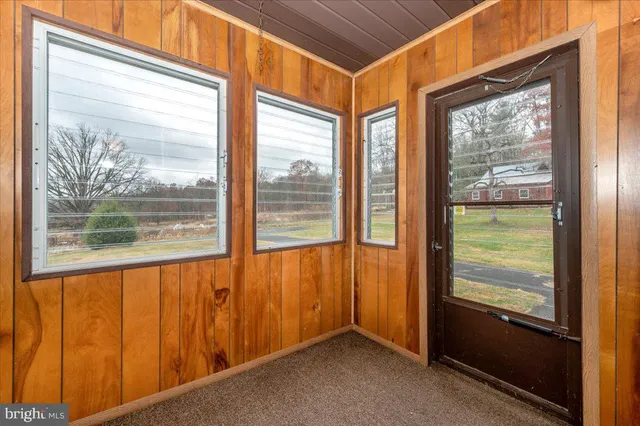 a room that has a bed and a window