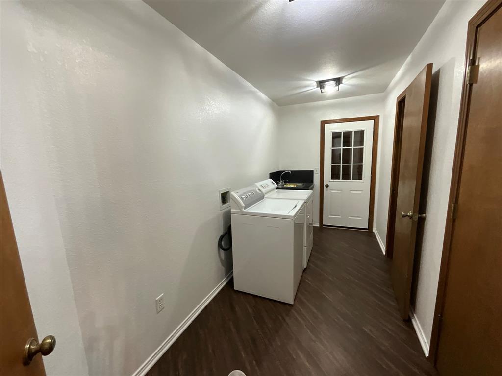 999 West Boynton Street Hamilton, TX 76531 - Photo 18 of 26 a view of a storage & utility room with washer and dryer