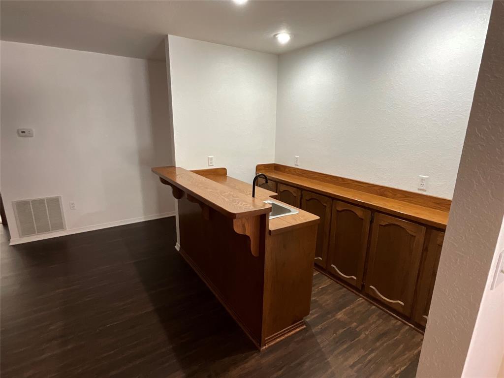 999 West Boynton Street Hamilton, TX 76531 - Photo 24 of 26 a view of wooden floor and staircase