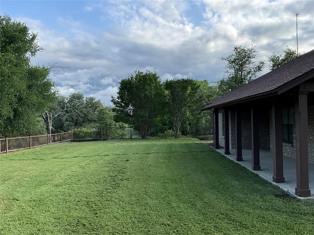 999 West Boynton Street Hamilton, TX 76531 - Photo 3 of 26 a view of a backyard