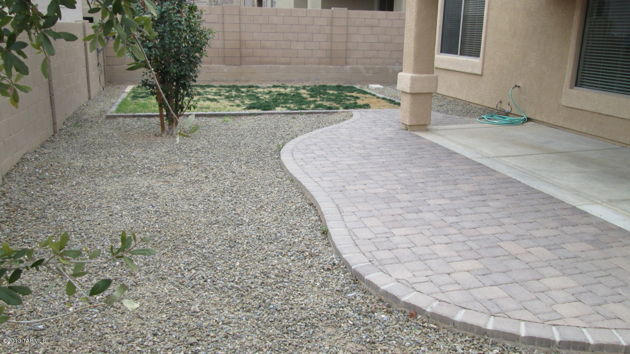 10855 East New Rock Ridge Drive Vail, AZ 85641 - Photo 27 of 34 a front view of a house with a yard