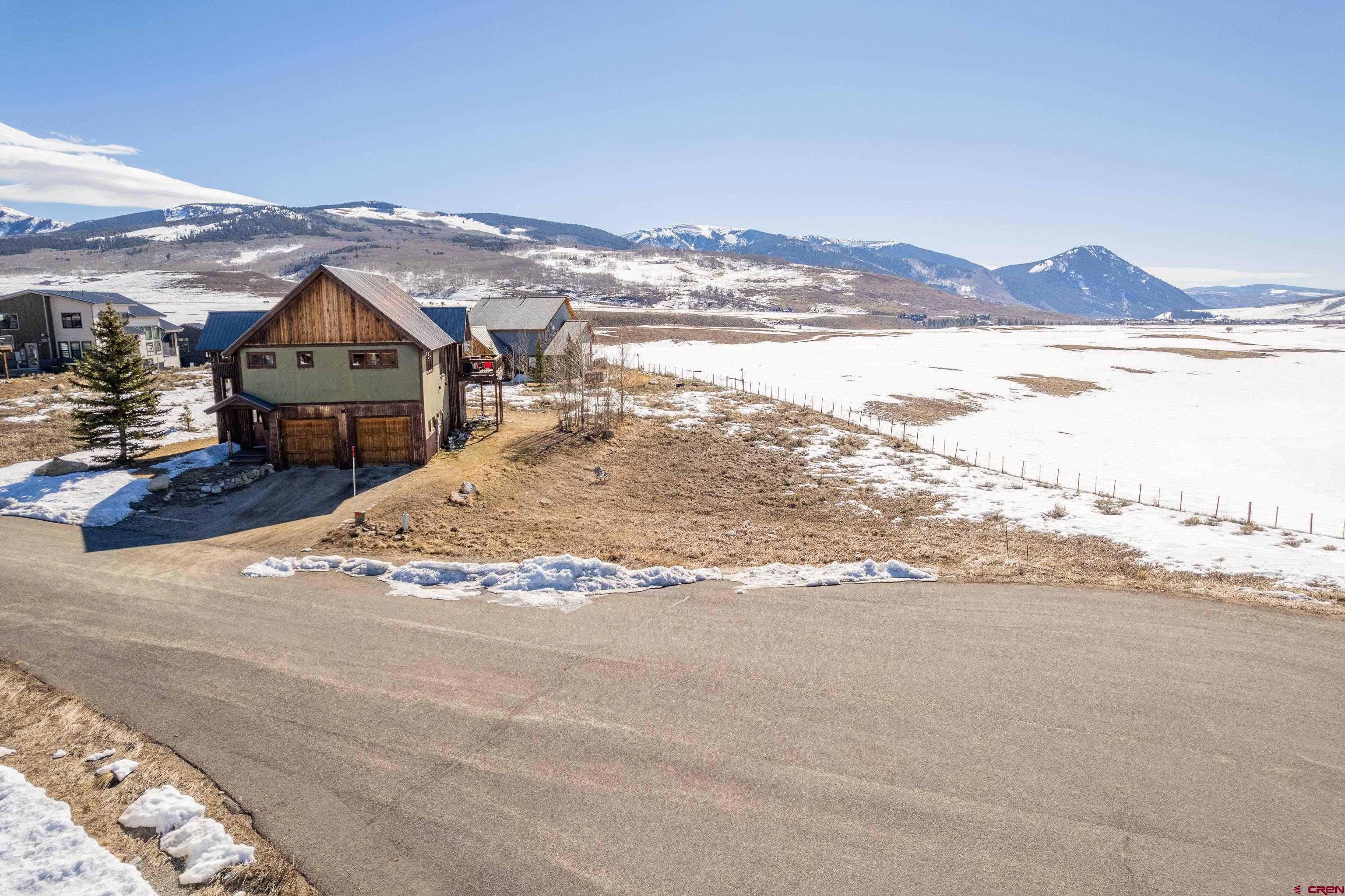 88 Bridle Spur Way Crested Butte, CO 81224 - Photo 4 of 13 a view of a large body of water with a building in the background