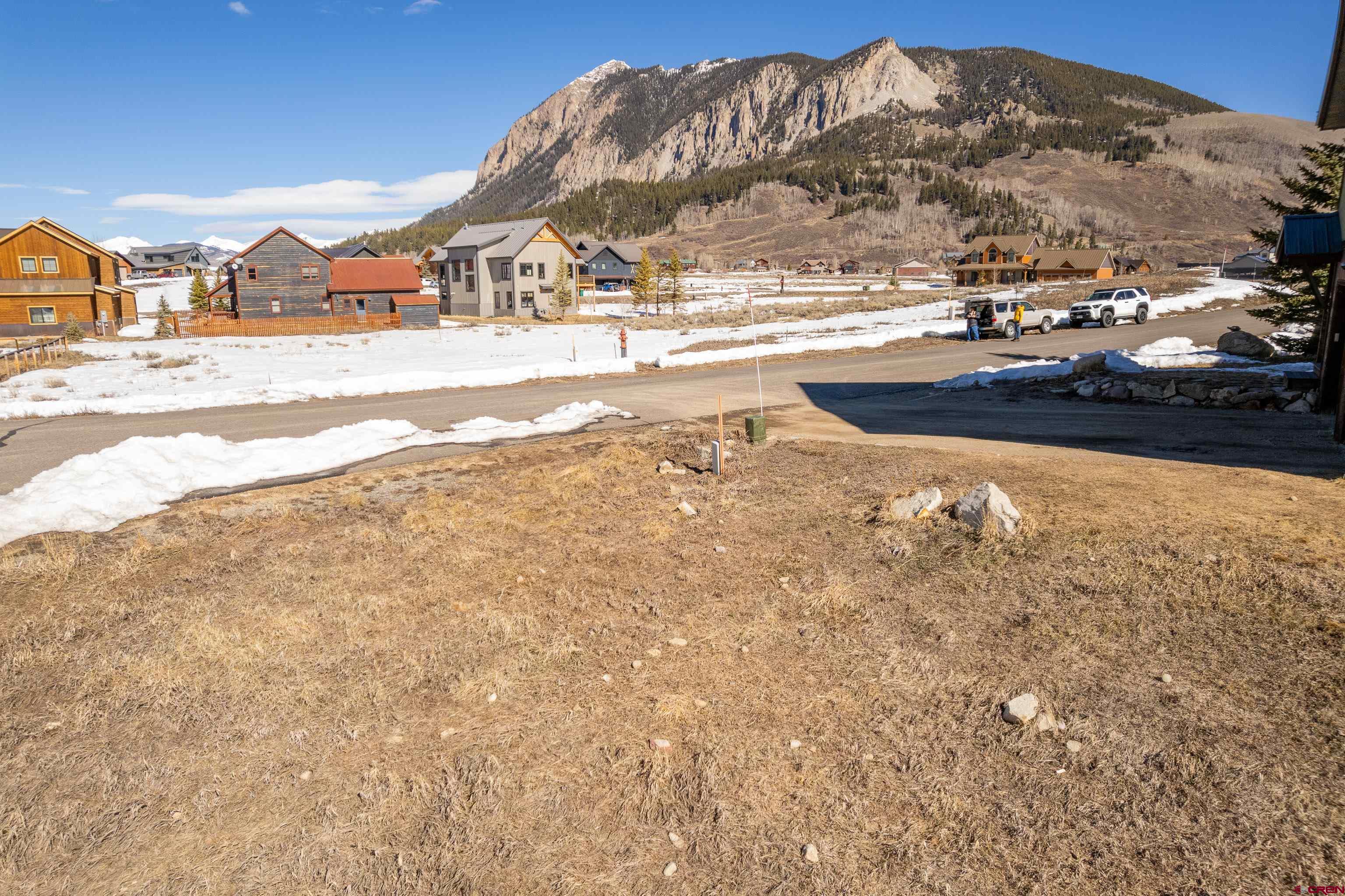 88 Bridle Spur Way Crested Butte, CO 81224 - Photo 6 of 13 a view of large house with a road near an ocean