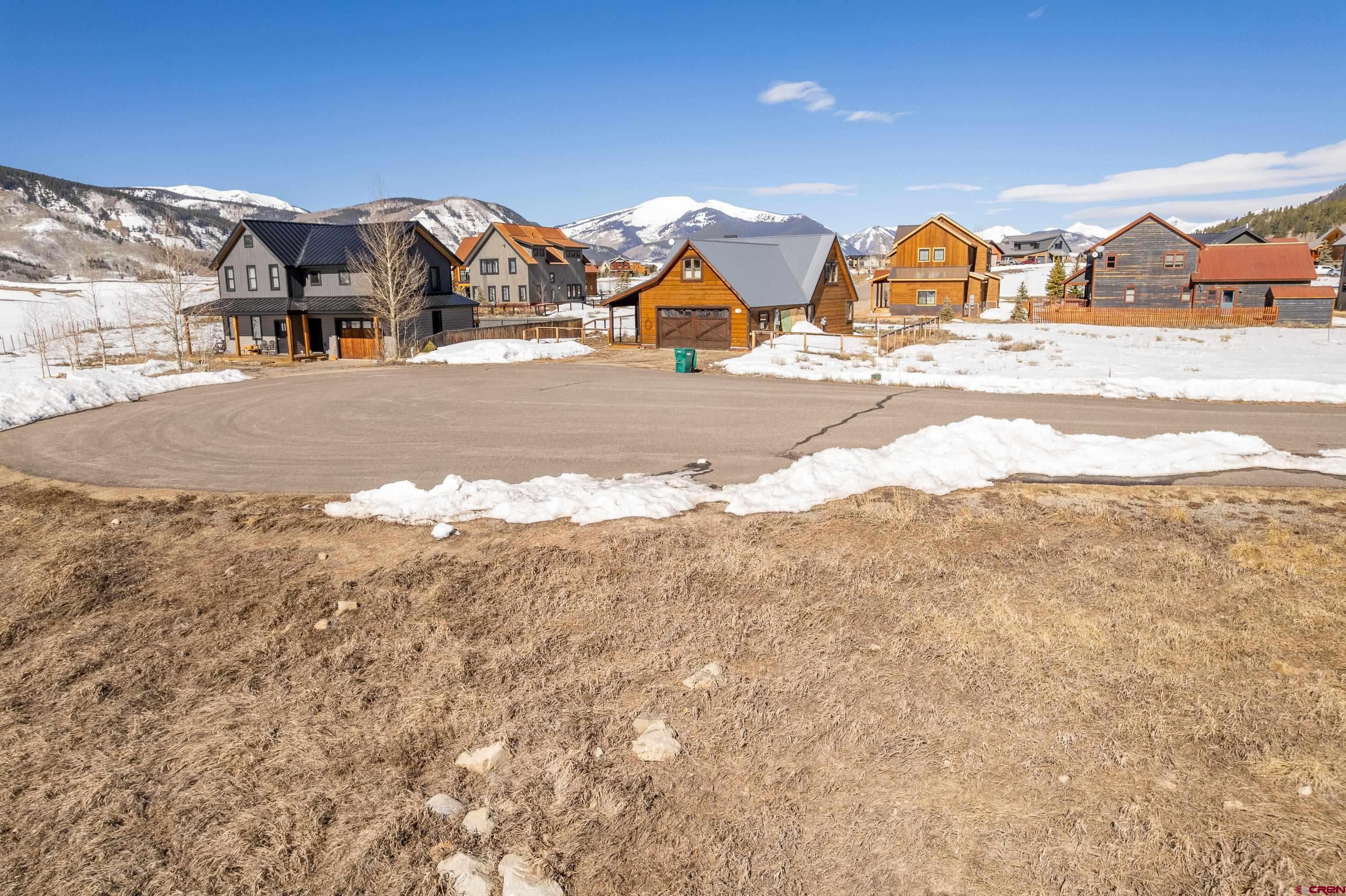 88 Bridle Spur Way Crested Butte, CO 81224 - Photo 9 of 13 a view of houses with snow on the road