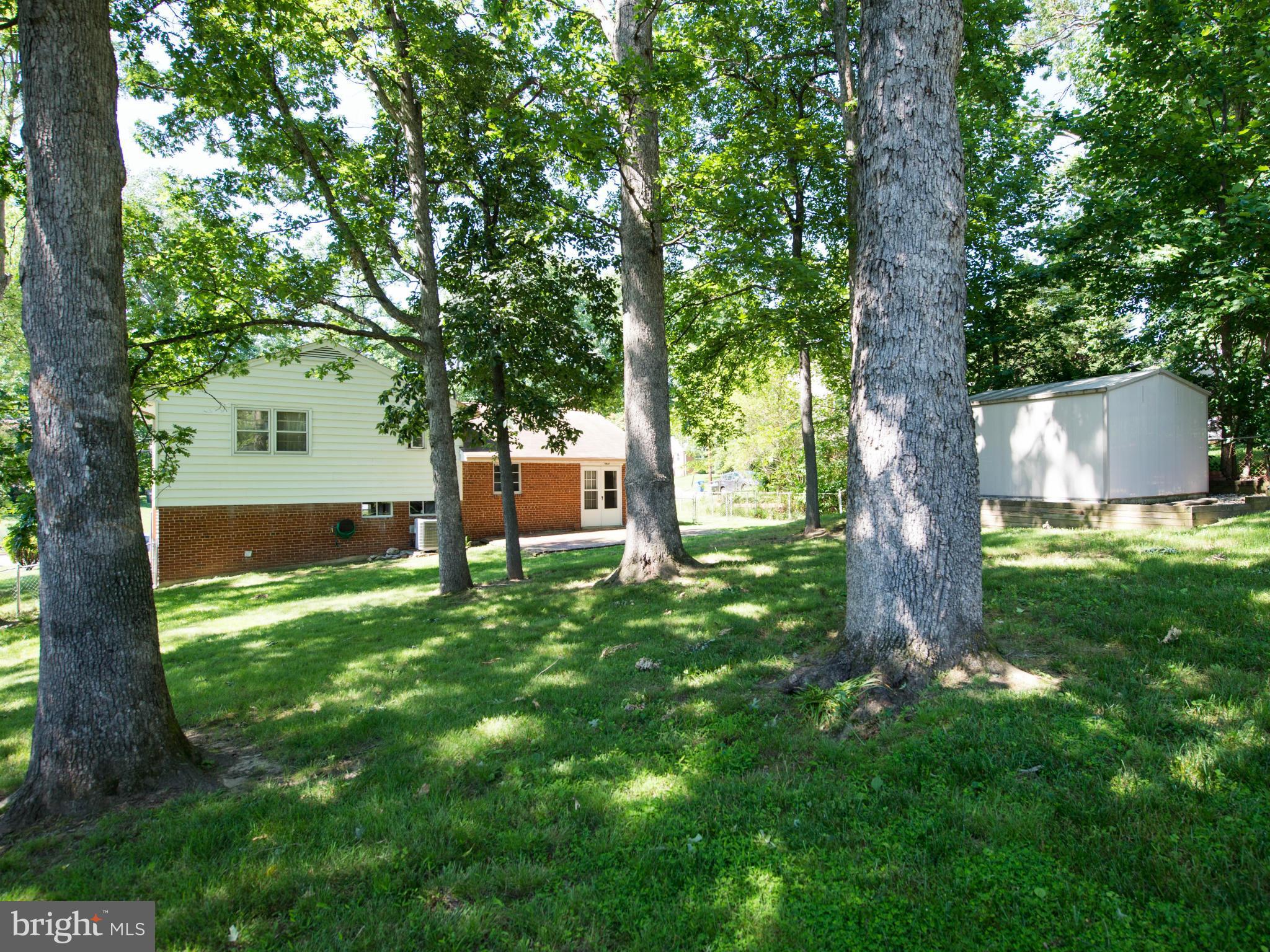 5949 Atteentee Road Springfield, VA 22150 - Photo 20 of 22 a view of outdoor space with deck and garden