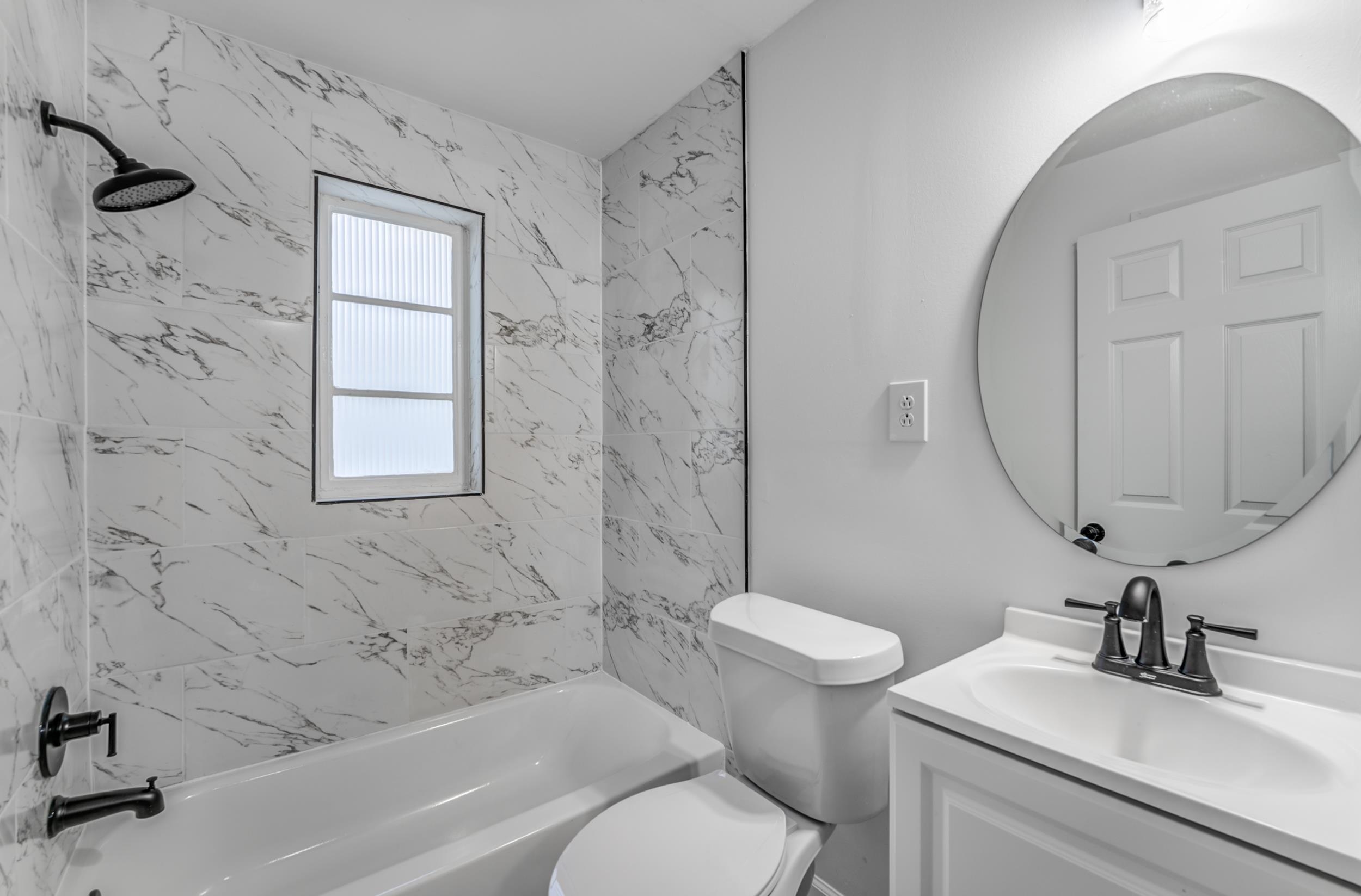 4903 Quince Road Memphis, TN 38117 - Photo 19 of 20 Bathroom featuring shower combination and vanity