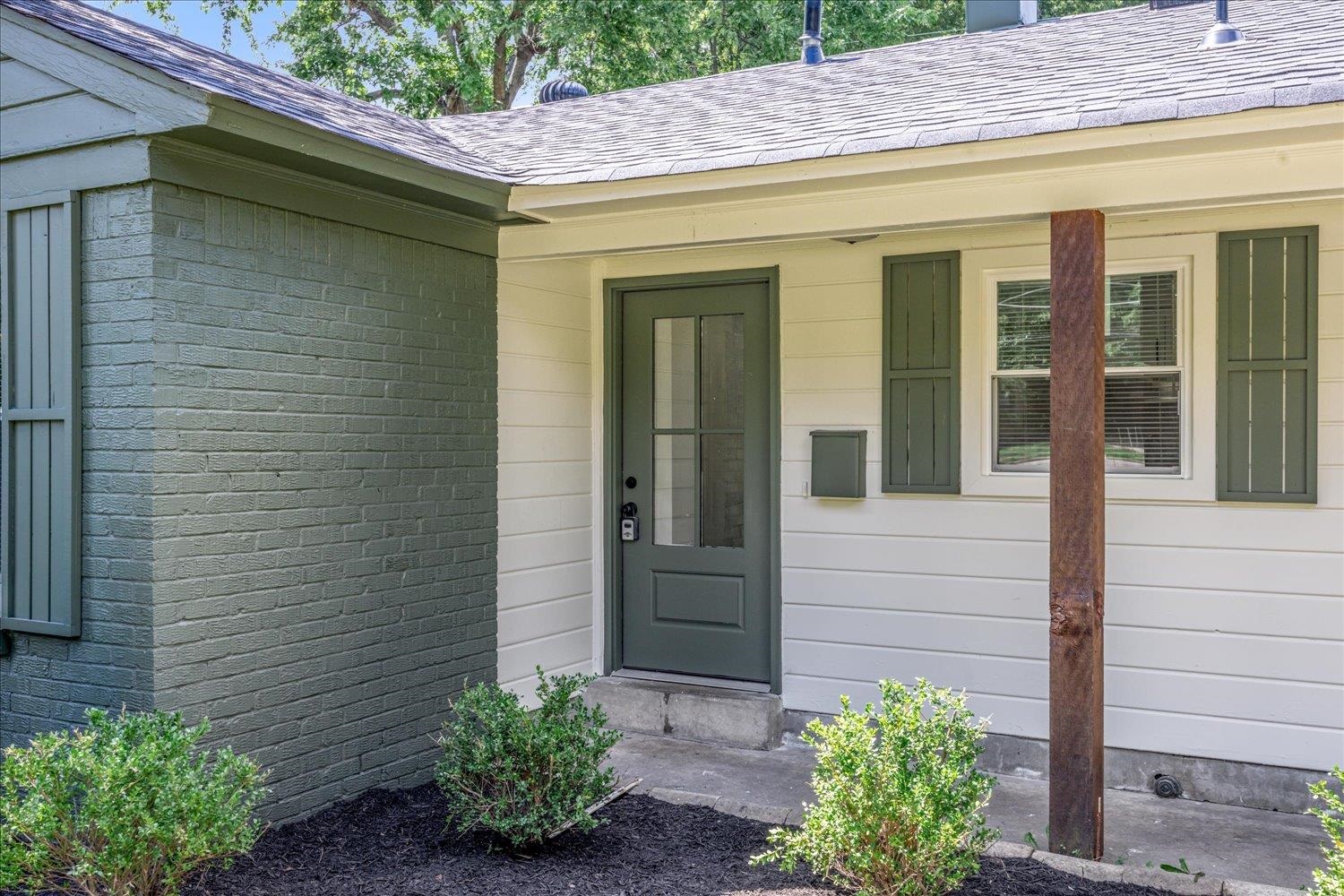 4903 Quince Road Memphis, TN 38117 - Photo 3 of 20 Property entrance featuring a shingled roof