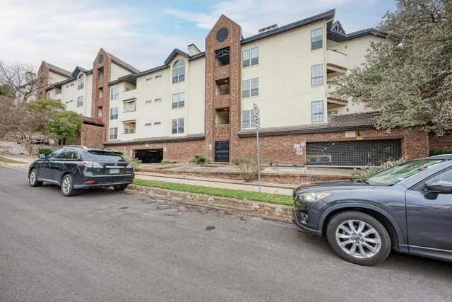 a view of a car parked in front of a house