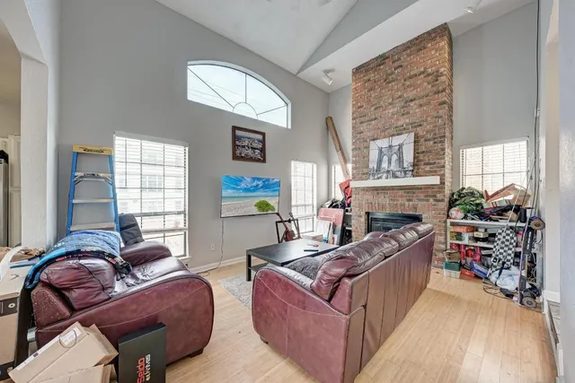a living room with furniture and a fireplace