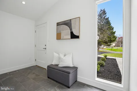a living room with furniture and a gate