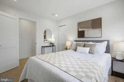 a bedroom with a bed and a tv