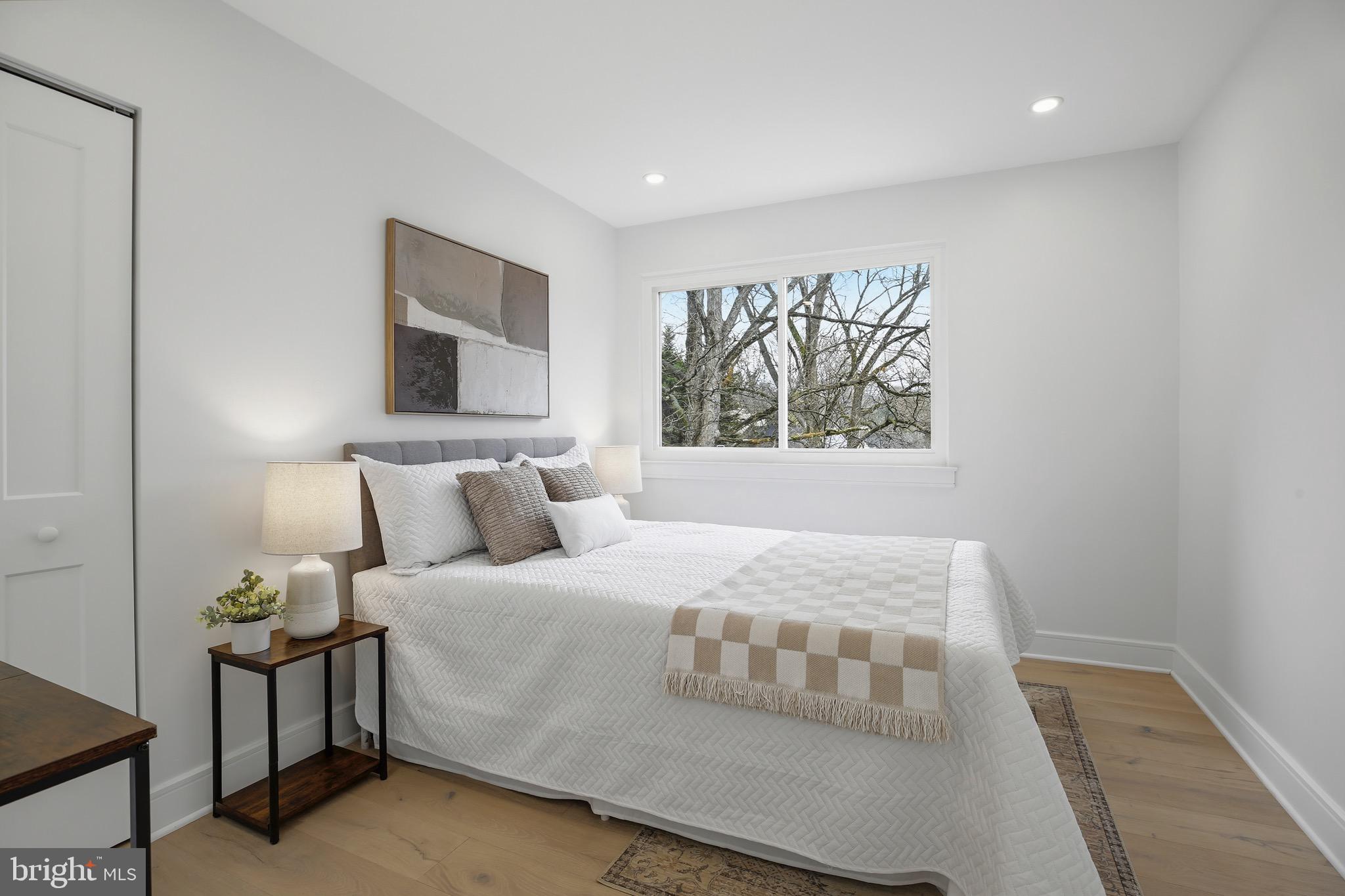 14828 Fireside Drive Silver Spring, MD 20905 - Photo 23 of 54 a bedroom with a bed and a window