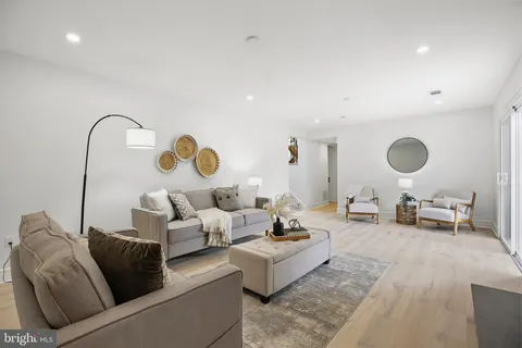 a living room with furniture and a rug