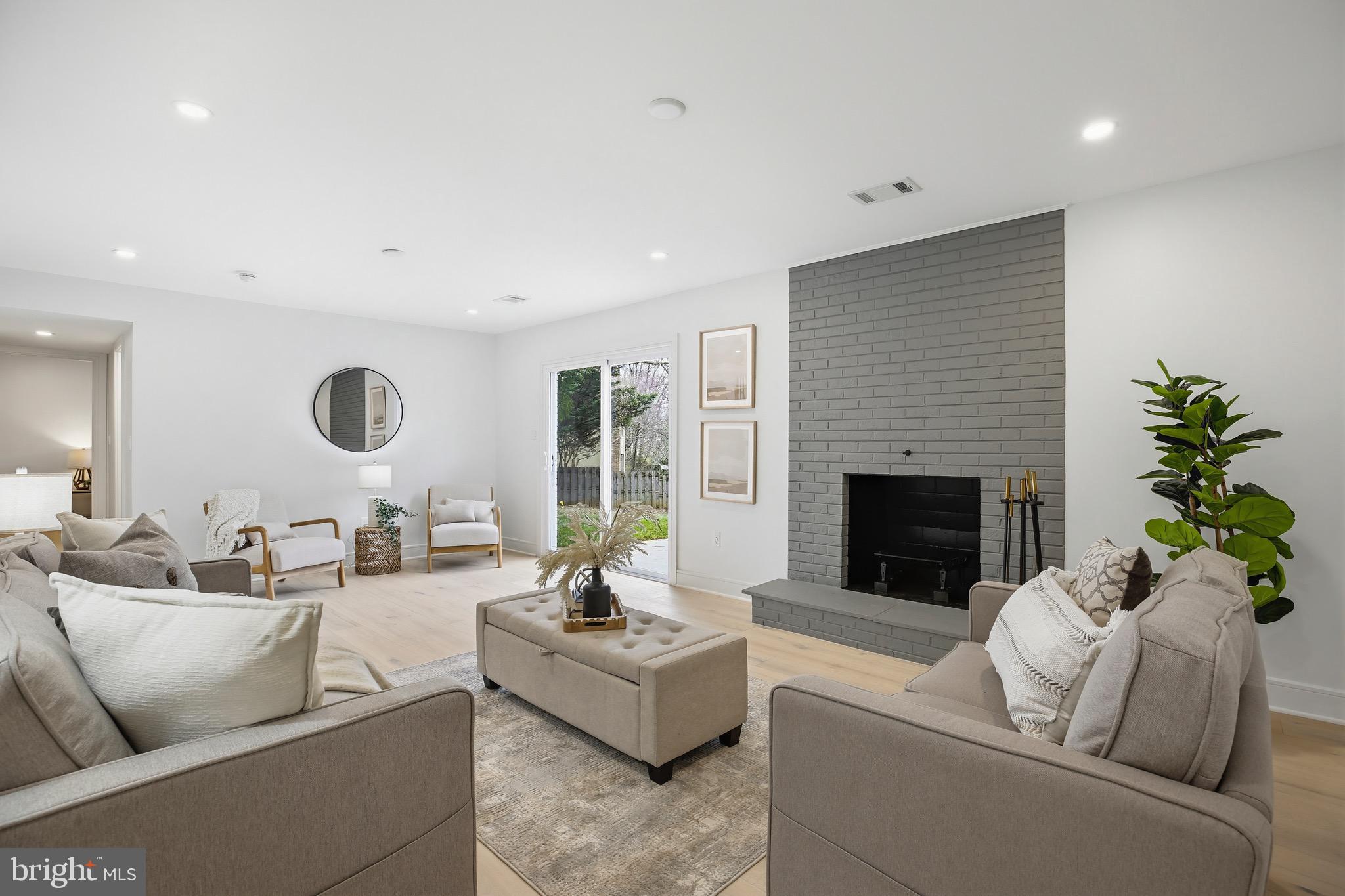 14828 Fireside Drive Silver Spring, MD 20905 - Photo 30 of 54 a living room with furniture and a fireplace